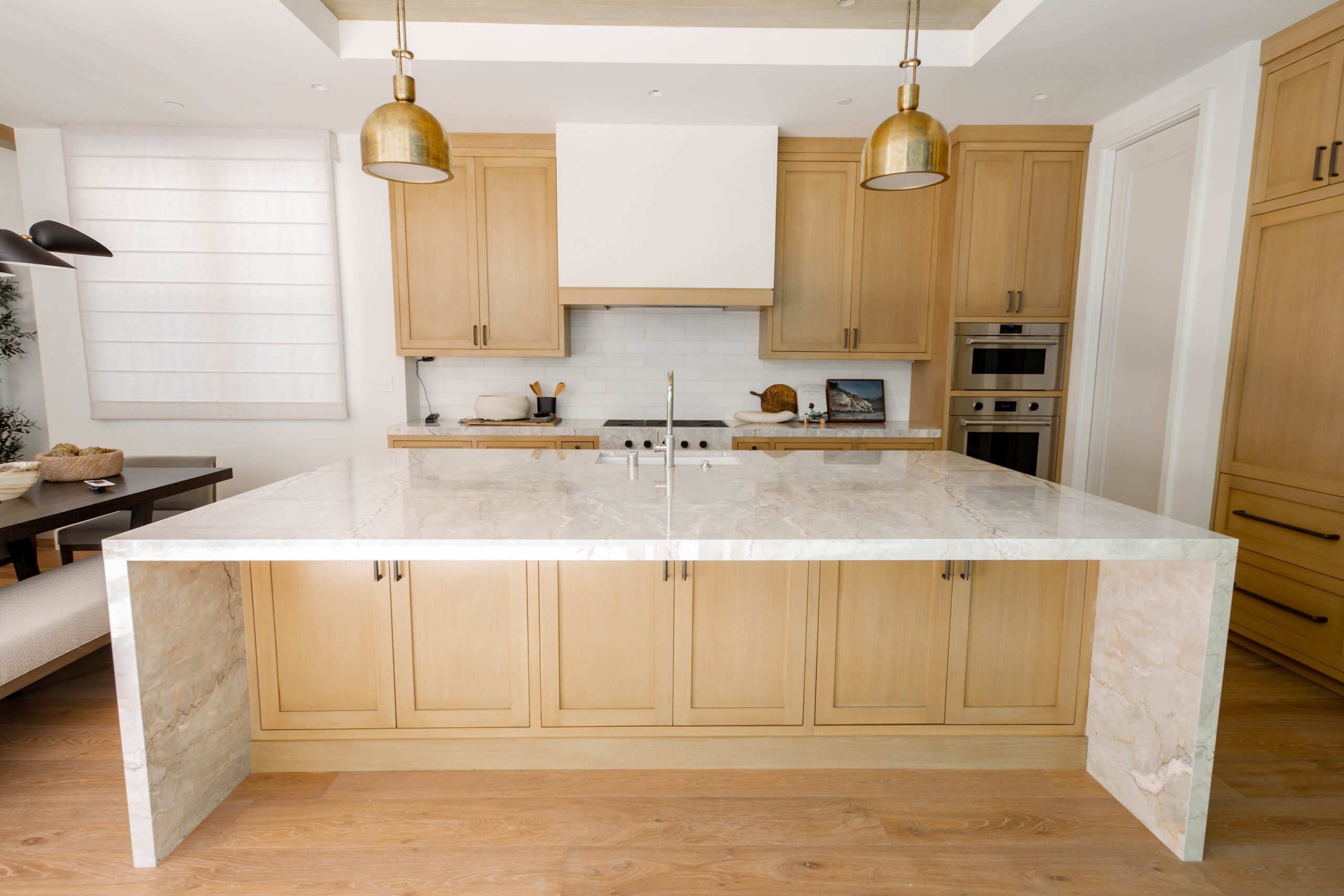 Luxury kitchen featuring natural stone countertops and custom cabinetry.