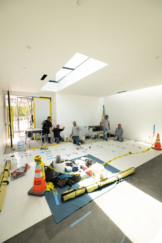 Epic Ceramic & Stone installation team preparing a luxury residential project before stone and tile installation in Orange County.