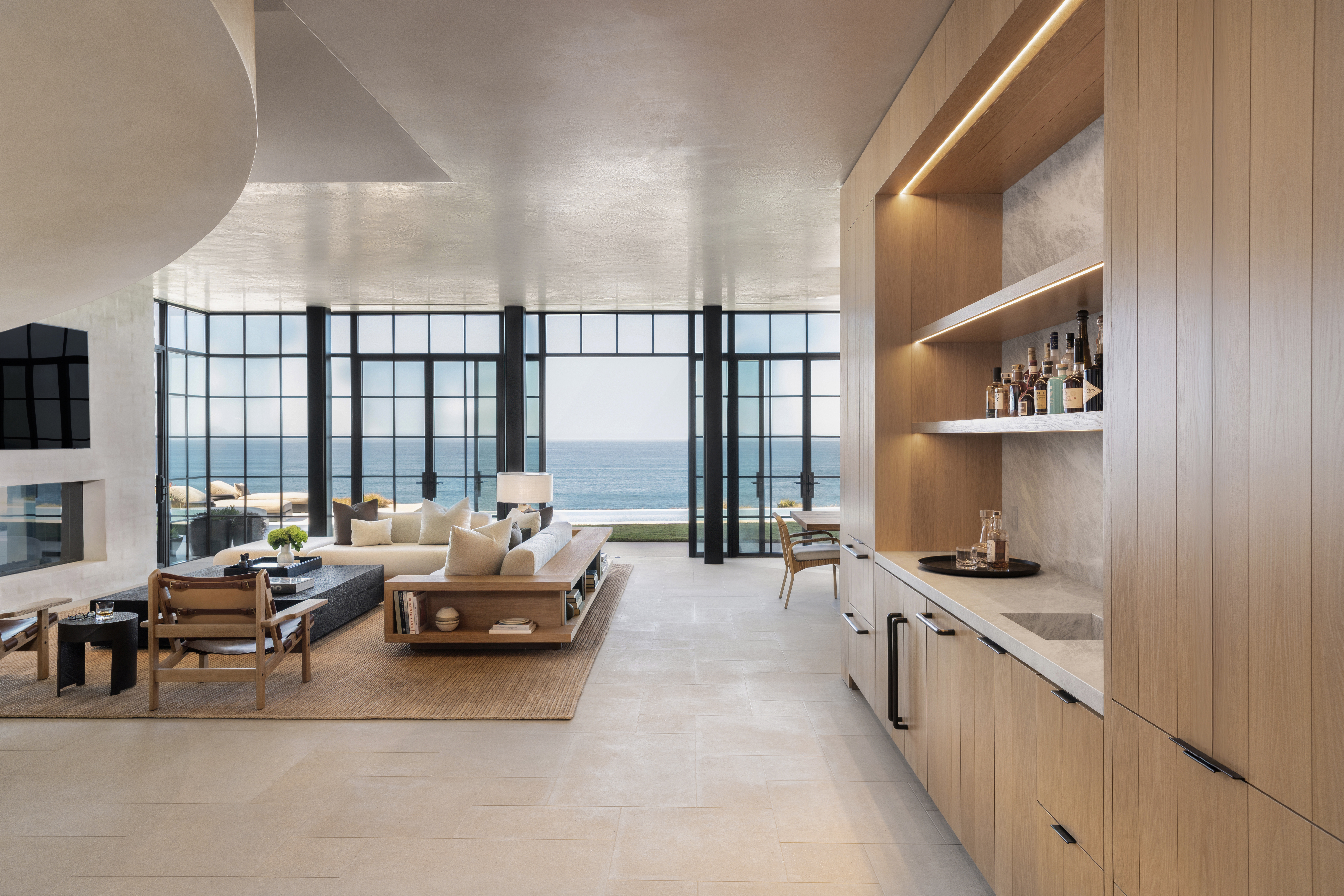 Natural stone flooring creates seamless indoor-outdoor continuity in a luxury Southern California home by Epic Ceramic & Stone.