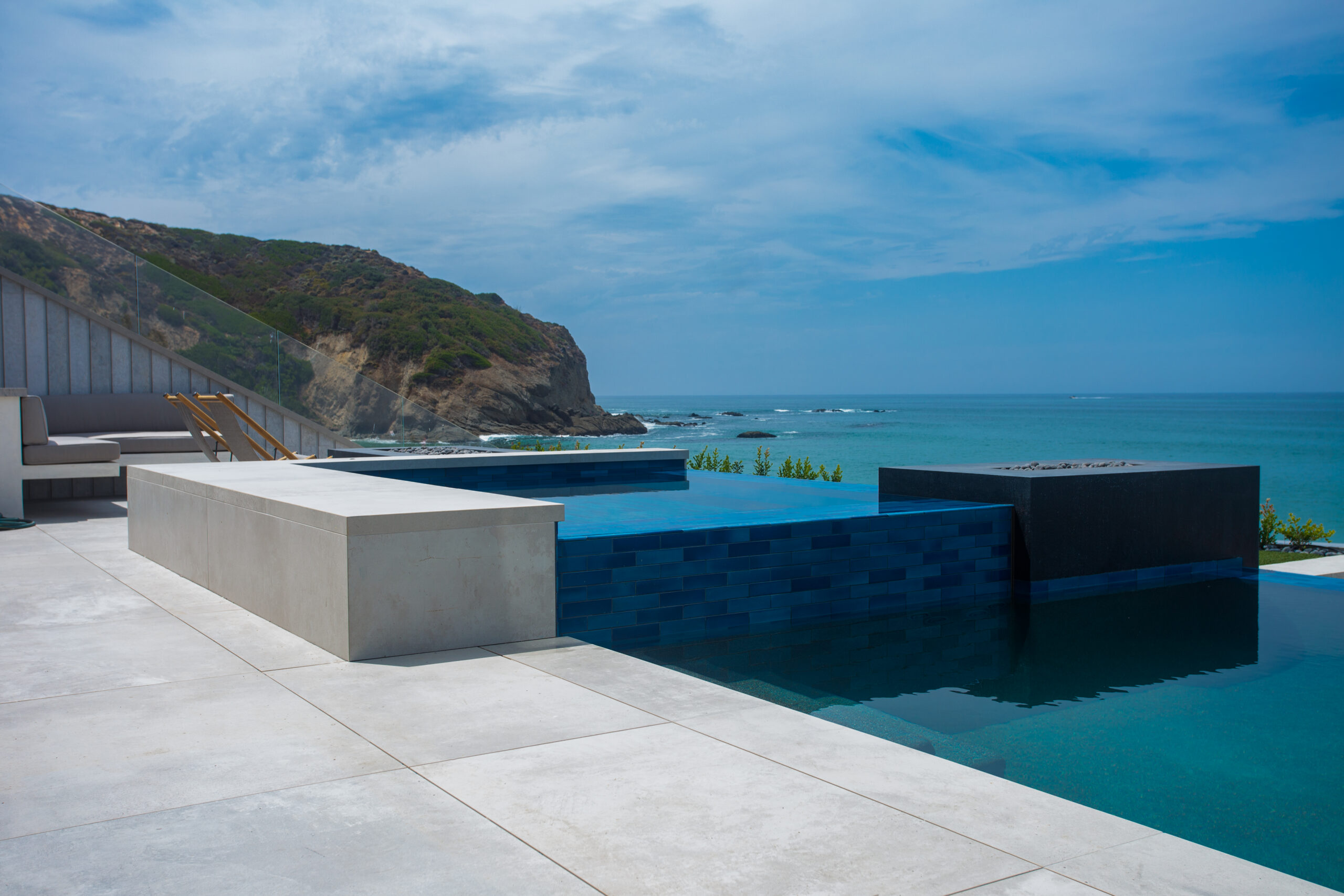 Large-format pool deck and coping at an oceanfront Southern California home