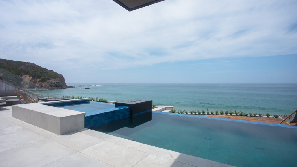 Large-format pool deck overlooking the ocean in Southern California
